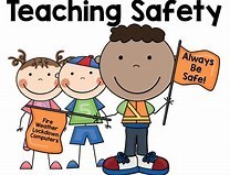 kids holding safety signs